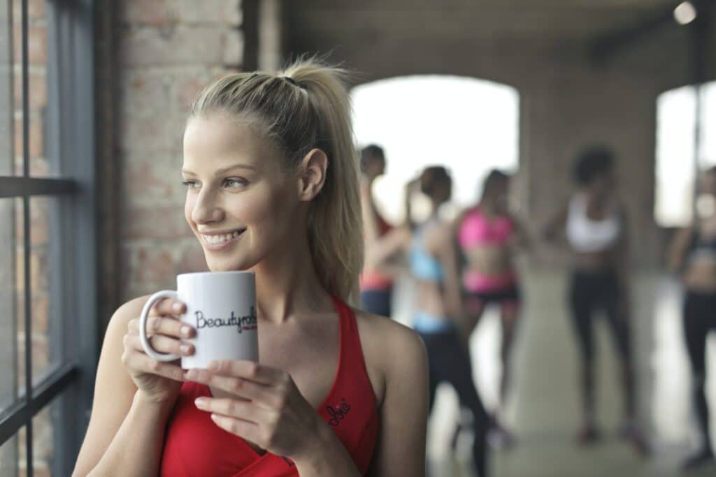 Happy woman drinking Java Burn Coffee